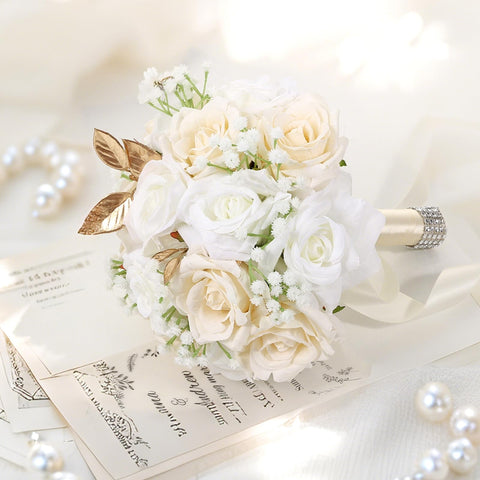 Qeedy bride bouquet shows satin-wrapped handle and rhinestones for a sparkle touch.