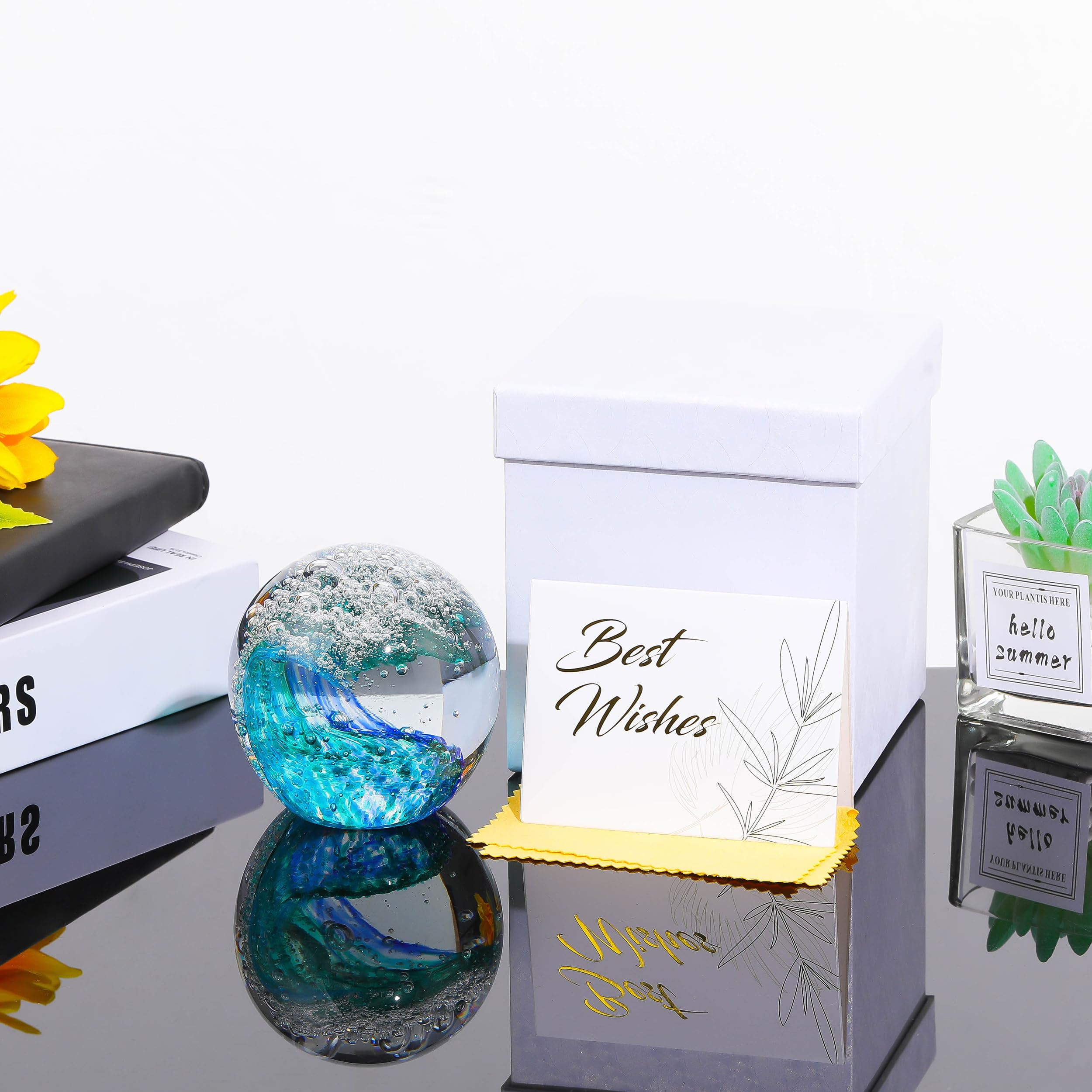 Qianwei glass ball paperweight with ocean waves, stylish office decor.