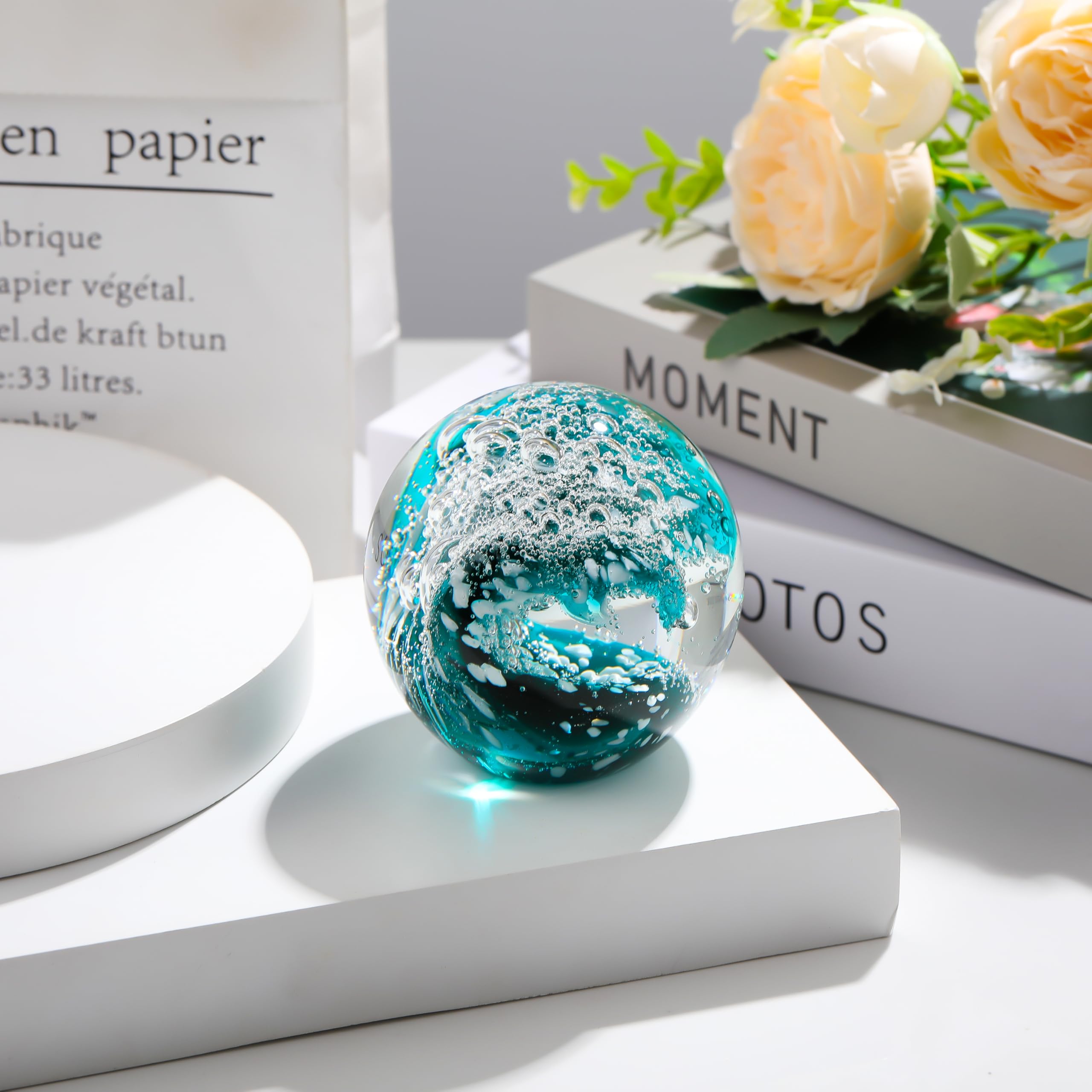 Qianwei crystal ball on a desk adds shimmer for office decor.