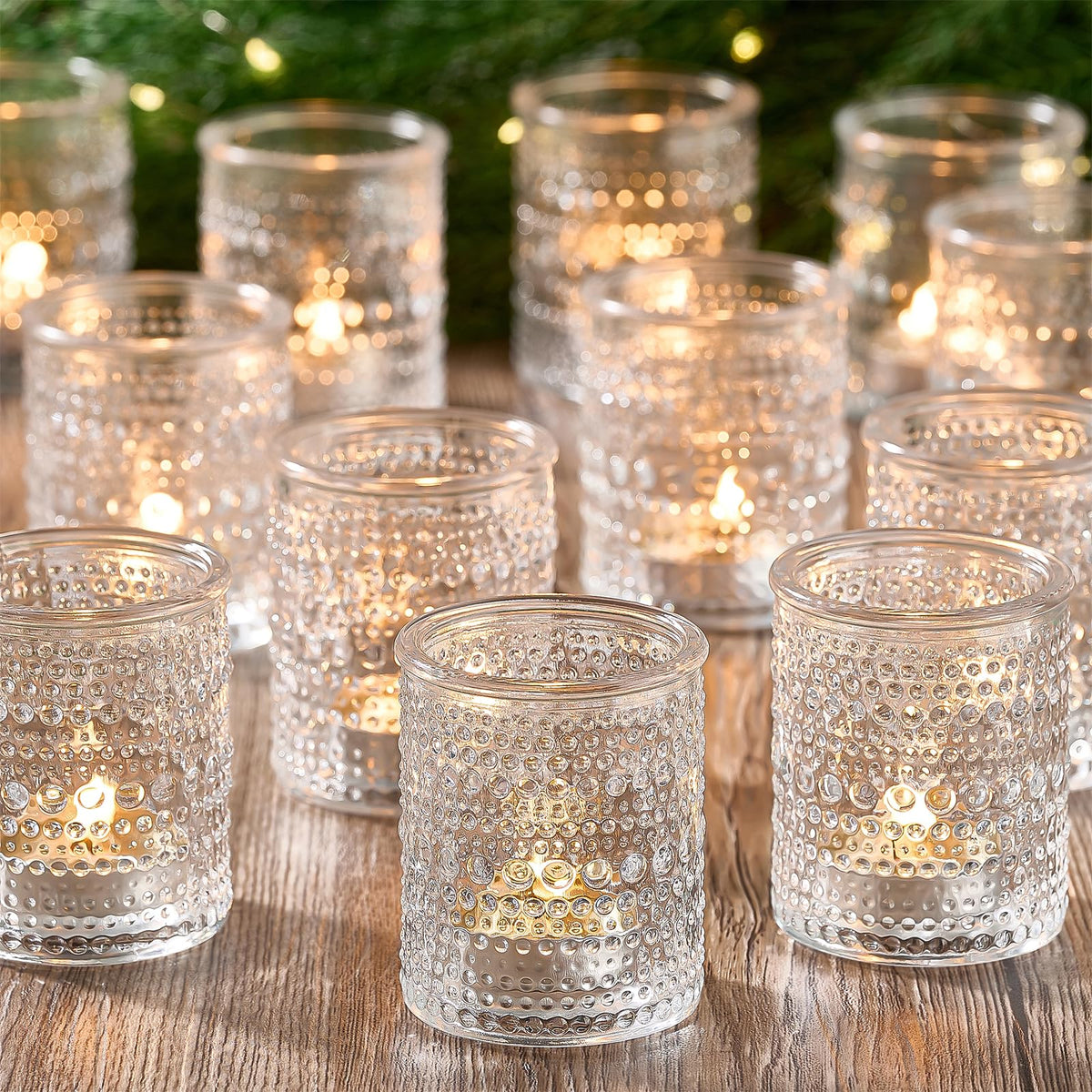 Qipecedm 24-pack clear glass votive holders for elegant table decor.