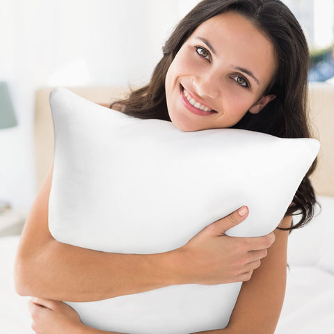 QSWRD 16x16 pillow inserts in porch and beach settings for versatile use.