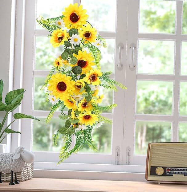 Sunflower garland on arch by QuarenDen enhances photos.