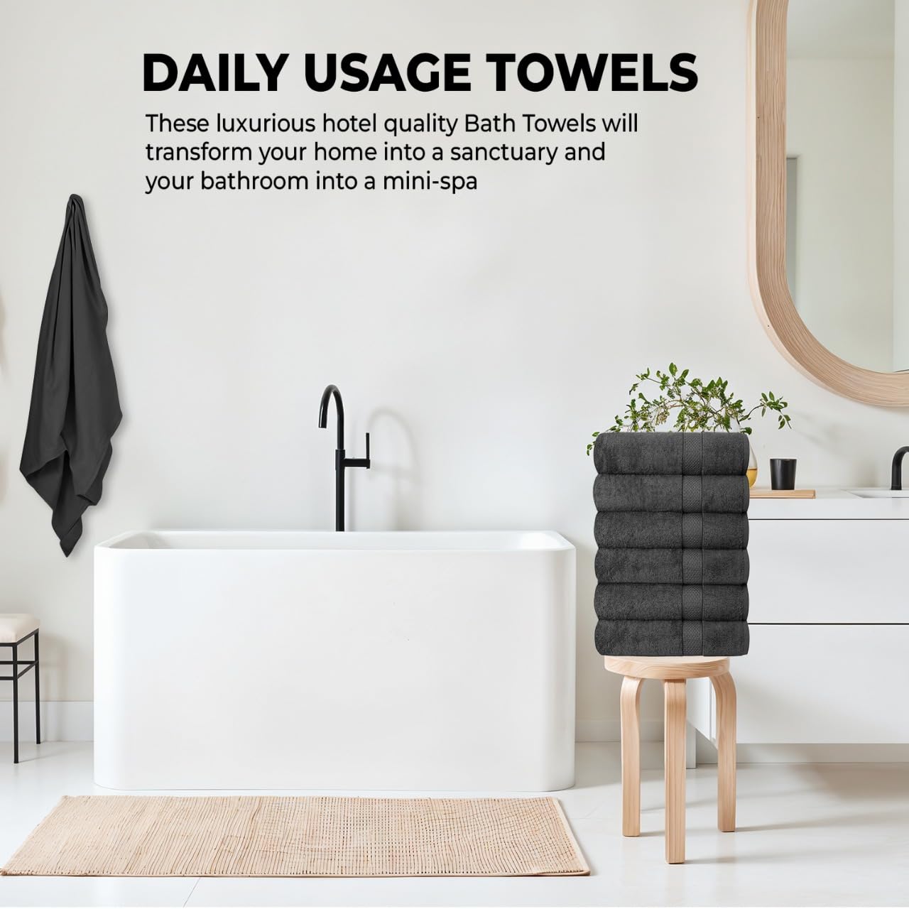 QUBA LINEN absorbent towels grey in a hotel room setting