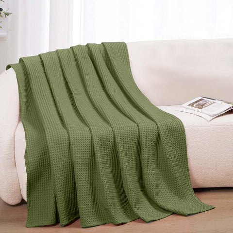 QUBA LINEN olive blanket adds subtle luxury to bedroom decor with soothing tone