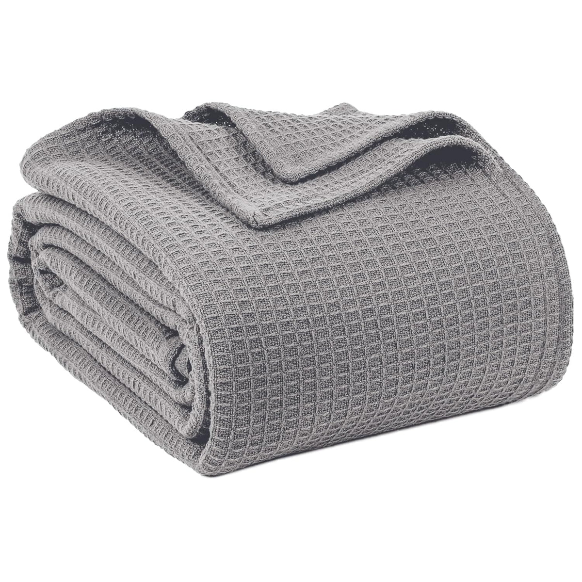 QUBA LINEN waffle blanket on a bed for lightweight summer comfort