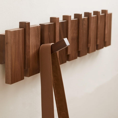 QUELLANCE close-up wood-grain finish emphasizes durable solid wood construction.
