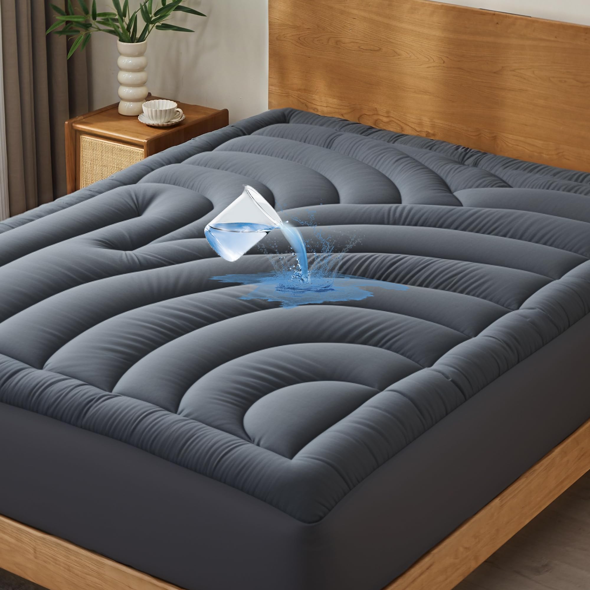 Quietsea waterproof mattress pad queen side view showing secure fit and spill protection.