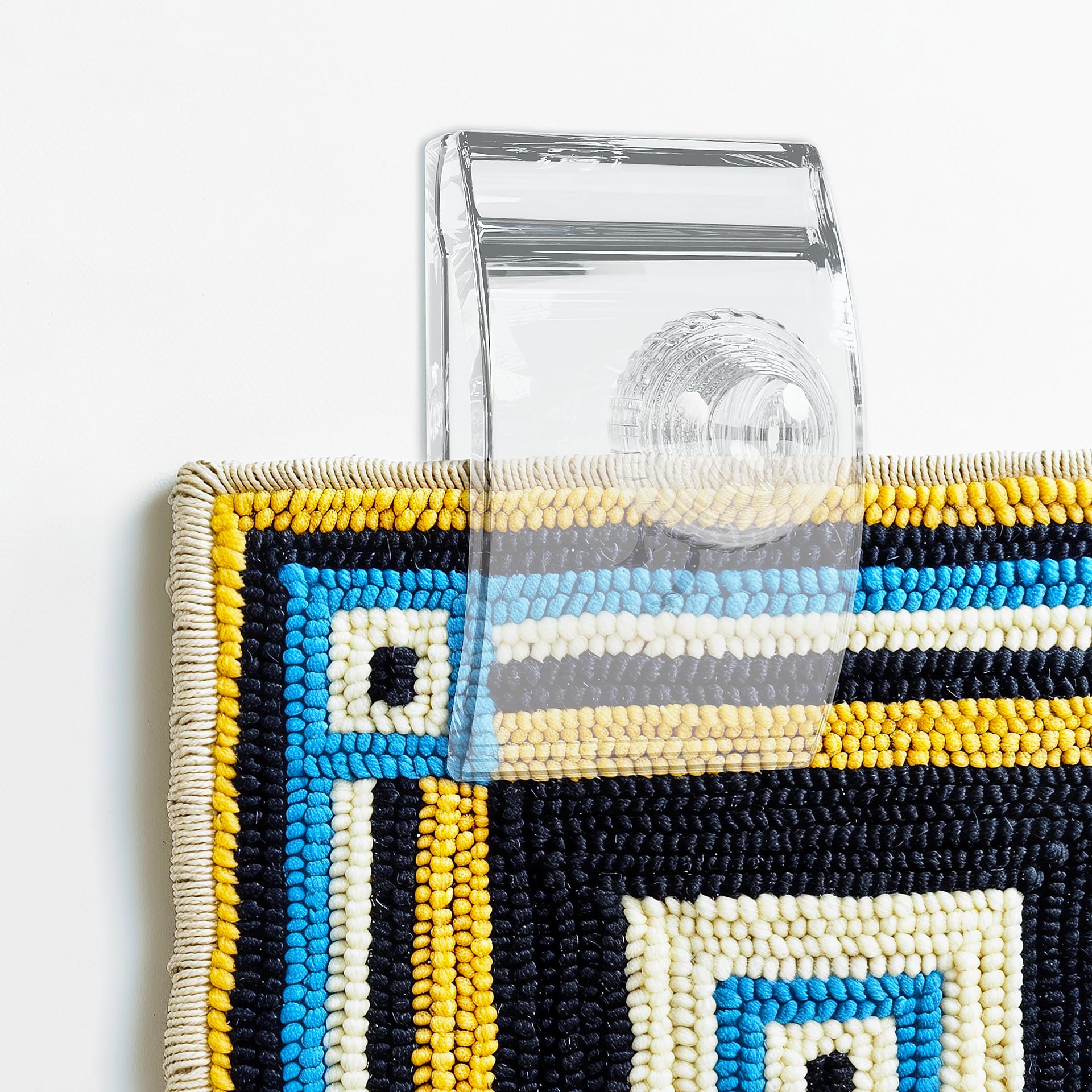 Quiltera wall hanging clamps secure textiles while preserving your décor.