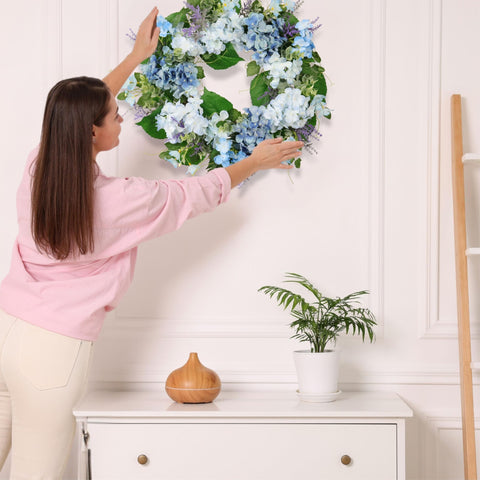 Quixem baby's breath accents add delicate, airy detail to the wreath.