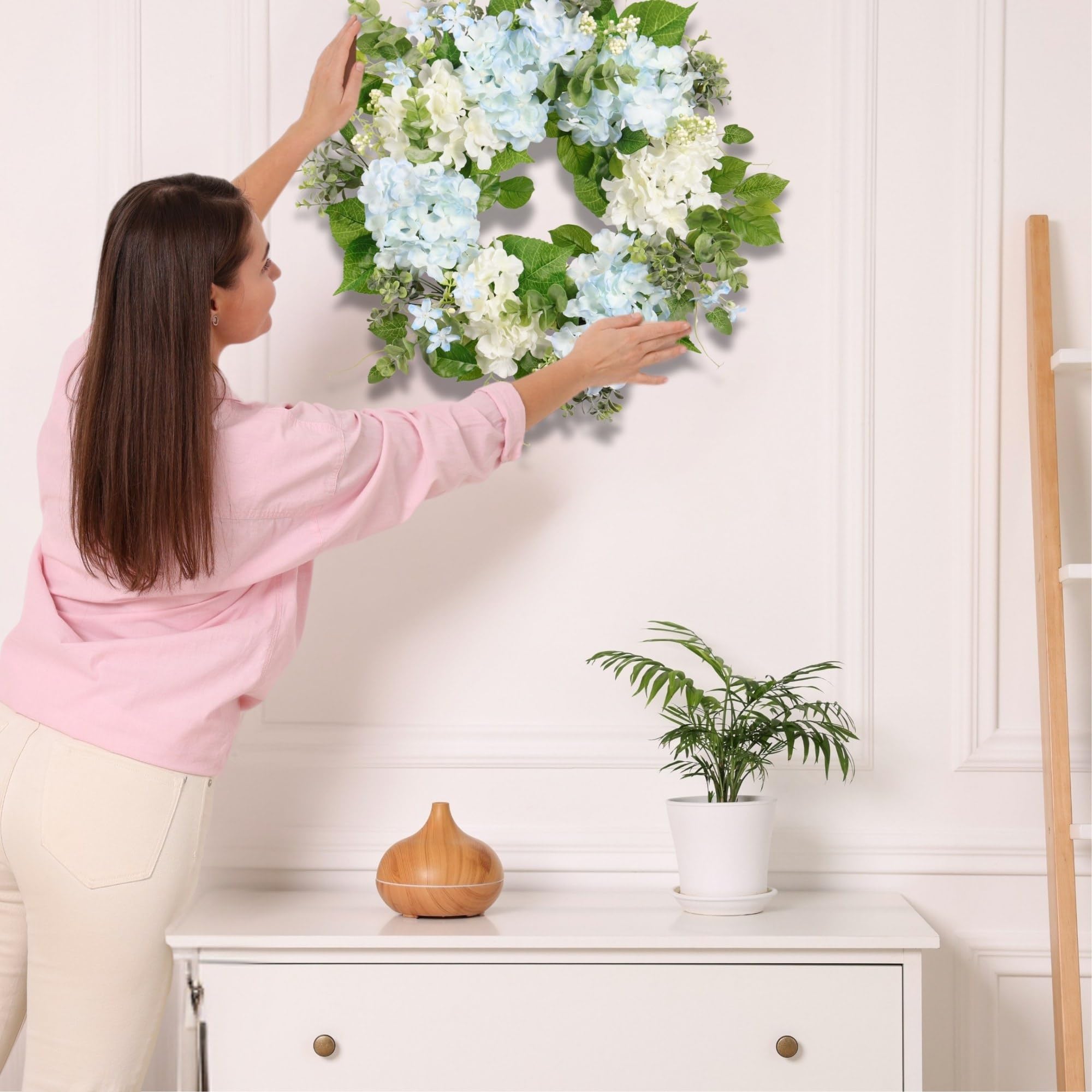 Quixem Front-door decor close-up wreath with hydrangea and eucalyptus.