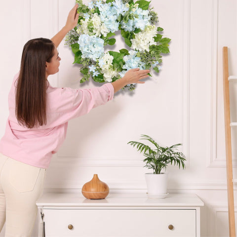 Quixem Front-door decor close-up wreath with hydrangea and eucalyptus.