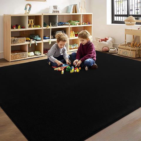 Qulint minimalist solid black 5x8 area rug complements modern decor.