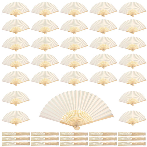 Qunclay white paper fan with hollow pattern, ideal for wedding decor.