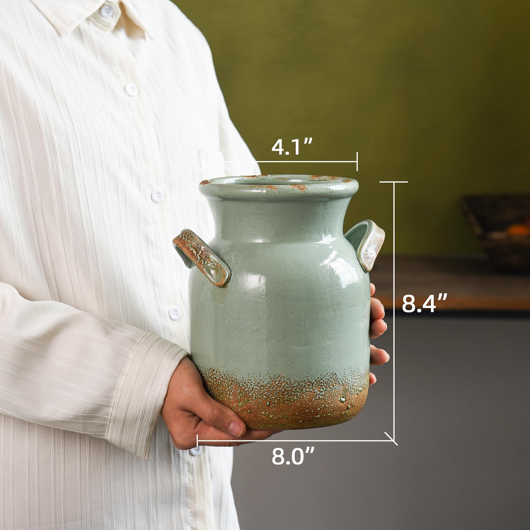 Quoowiit vintage-style vase with two handles enhances entryway styling.
