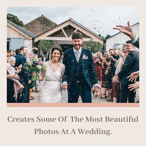 RainbowPana petals in air during wedding exit for magical photos.