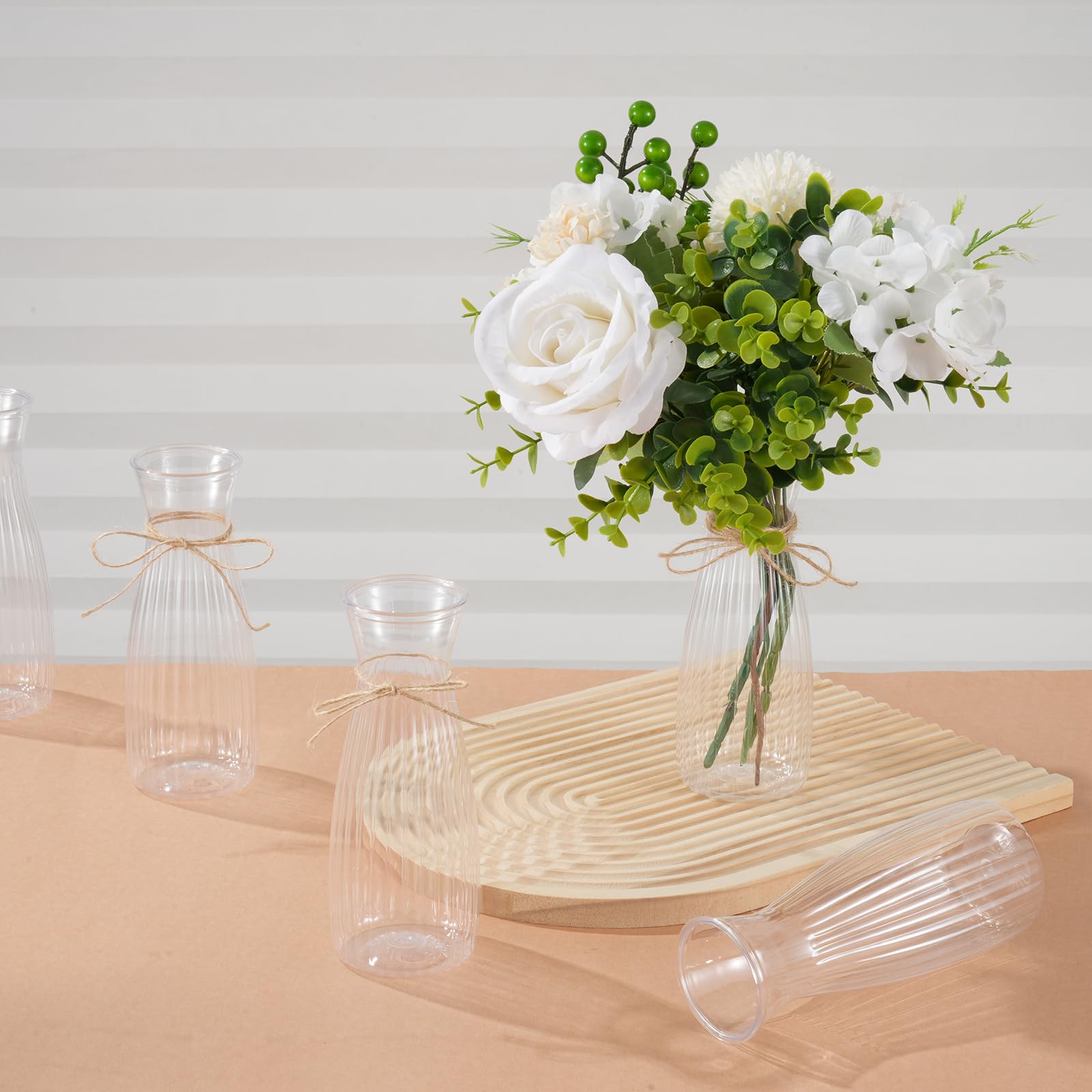 Rainmae clear vases highlight fresh or dried flowers beautifully.
