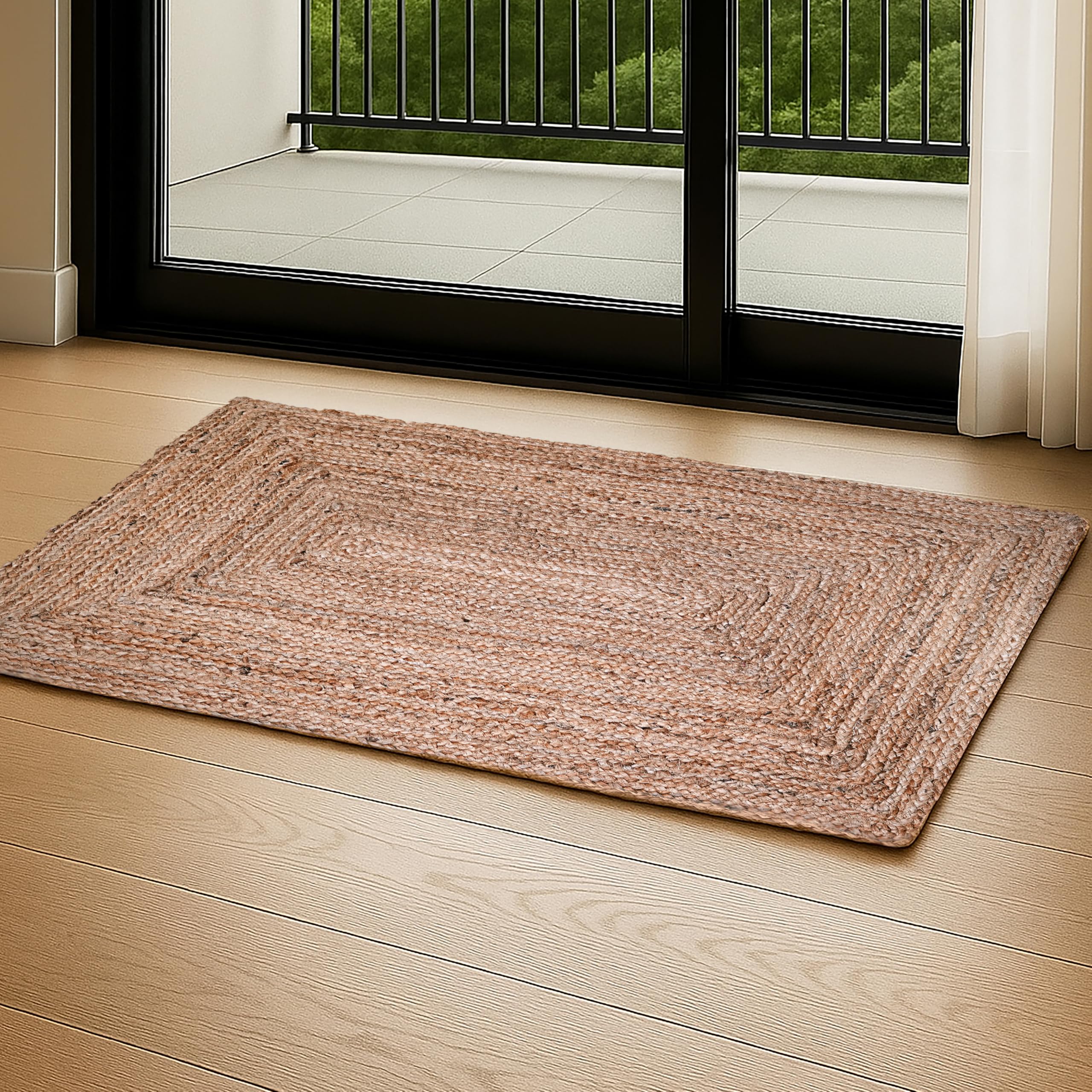 Ramanta Home hand woven jute braided rug with natural texture for versatile living spaces.