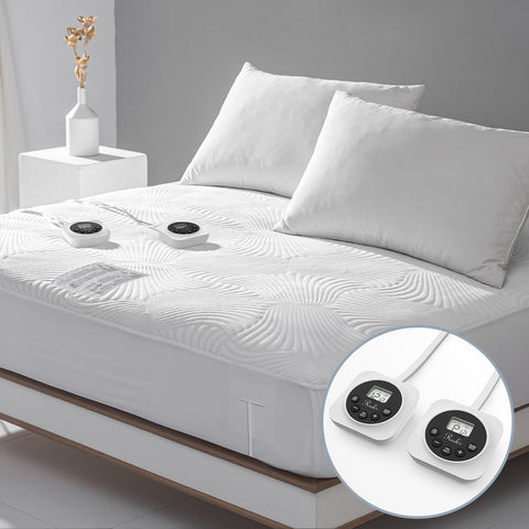 Reaks queen size heated mattress pad unfolded on bed for warm comfort