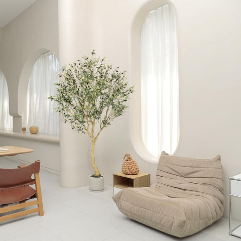 REALEAD olive tree features natural wood trunk for a convincing, timeless interior.