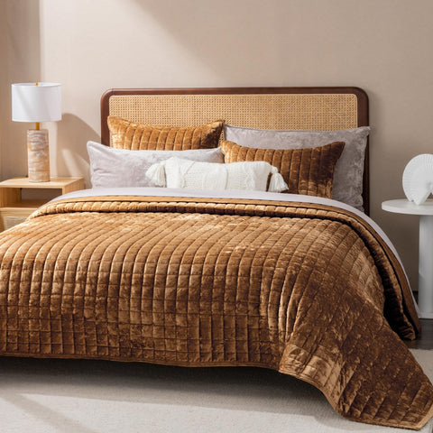 RECYCO channel stitch design on bedspread highlighting structured pattern.