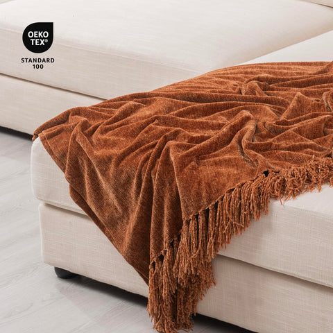 RECYCO throw blanket on bed illustrating cozy warmth for relaxing evenings