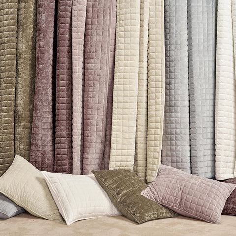 RECYCO beige velvet quilt draped on bed for easy styling