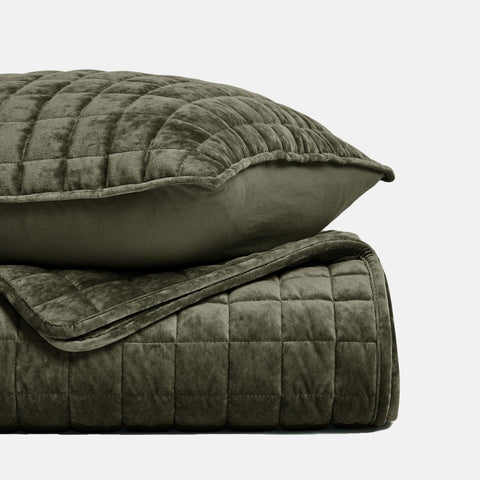 Olive green RECYCO velvet quilt enhances modern bedroom decor