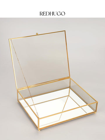 RedHUGO large glass box features brass and glass craftsmanship in a welded frame.