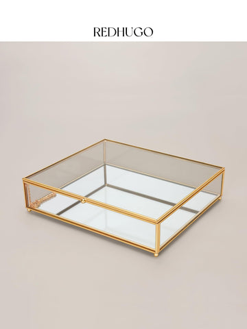 RedHUGO large glass box sits on a dressing table adding refined vanity decor.
