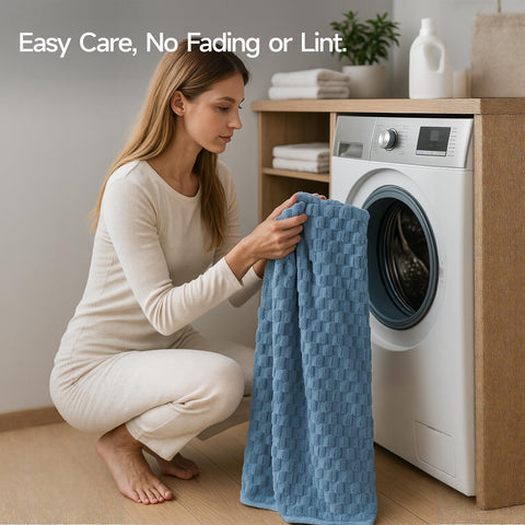 REDKISS blue towel with reinforced double-stitched edges for durability.