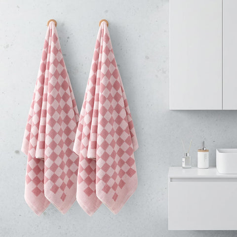 REDKISS towel used as headscarf or hair-drying accessory after shower.