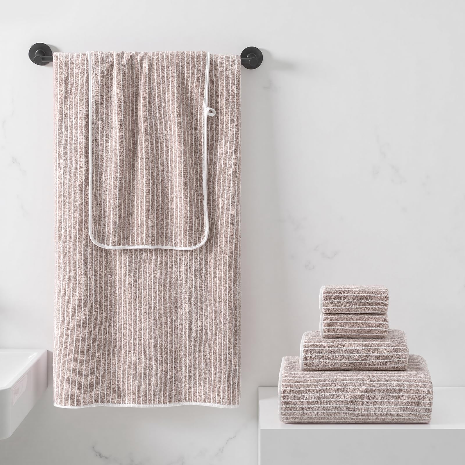 REDKISS taupe bath towels close-up showing plush texture for quick comforting wraps.