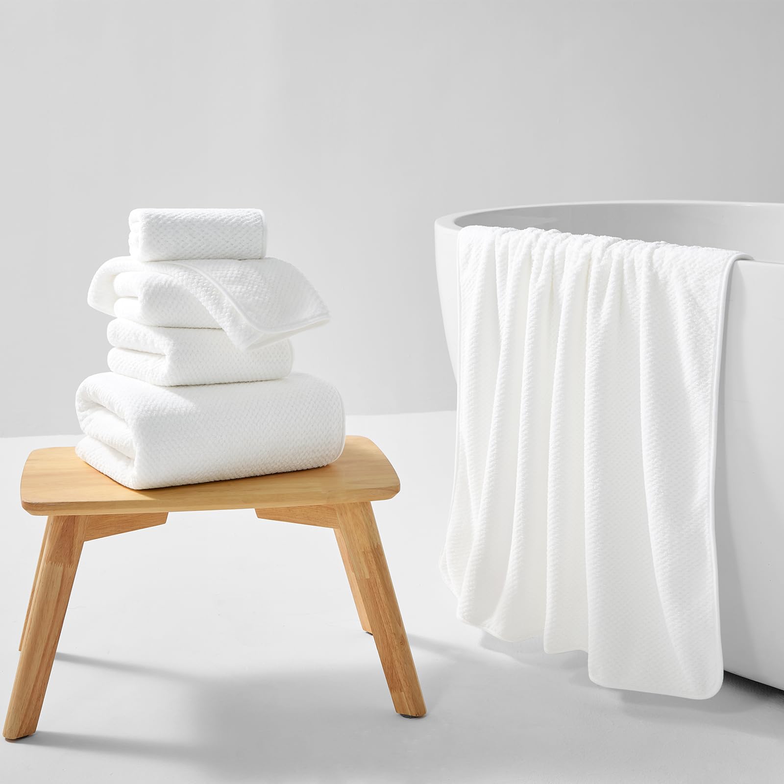 REDKISS towel set demonstrating absorbent, quick-dry capabilities after a shower.
