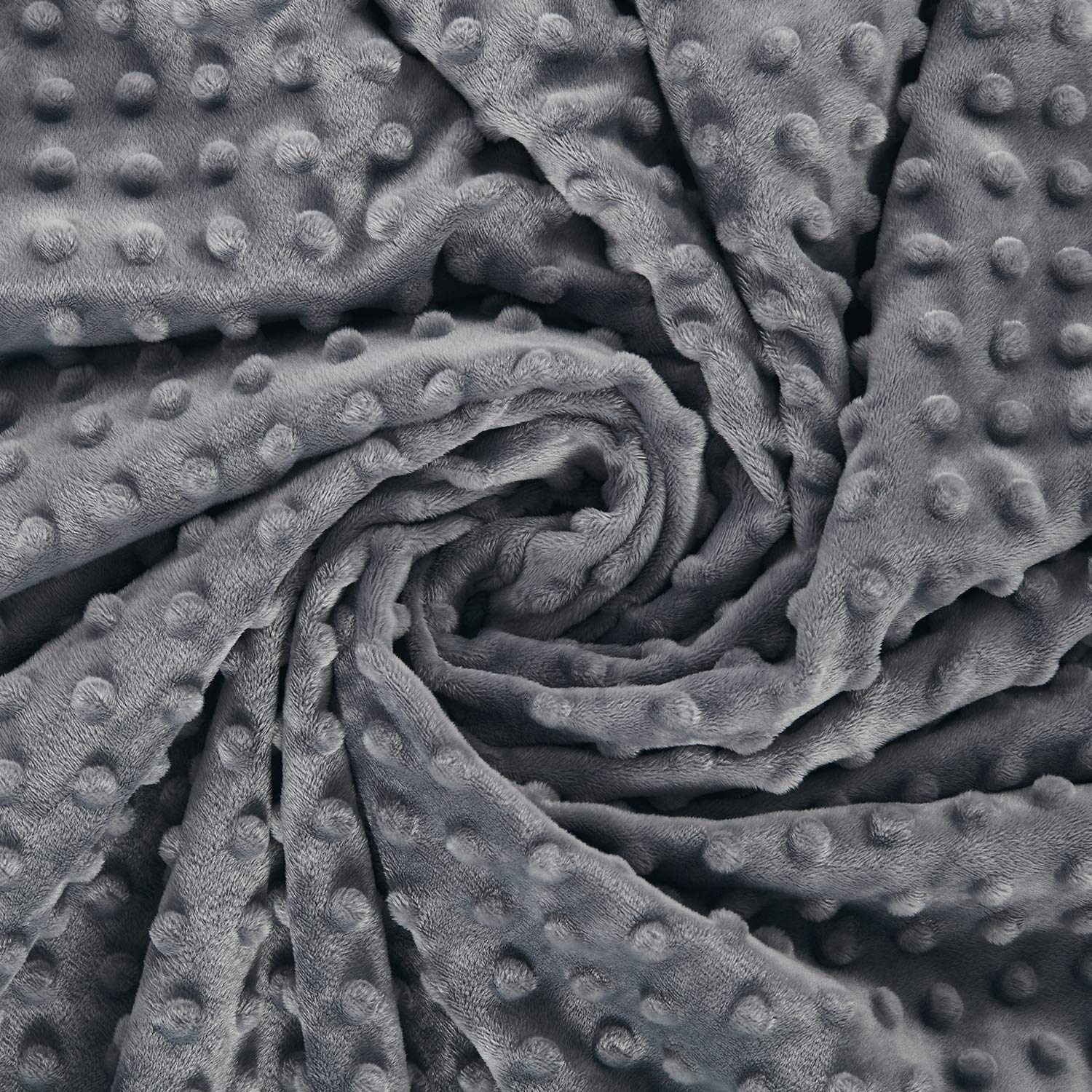 RelaxBlanket dark grey color complements modern bedroom decor.