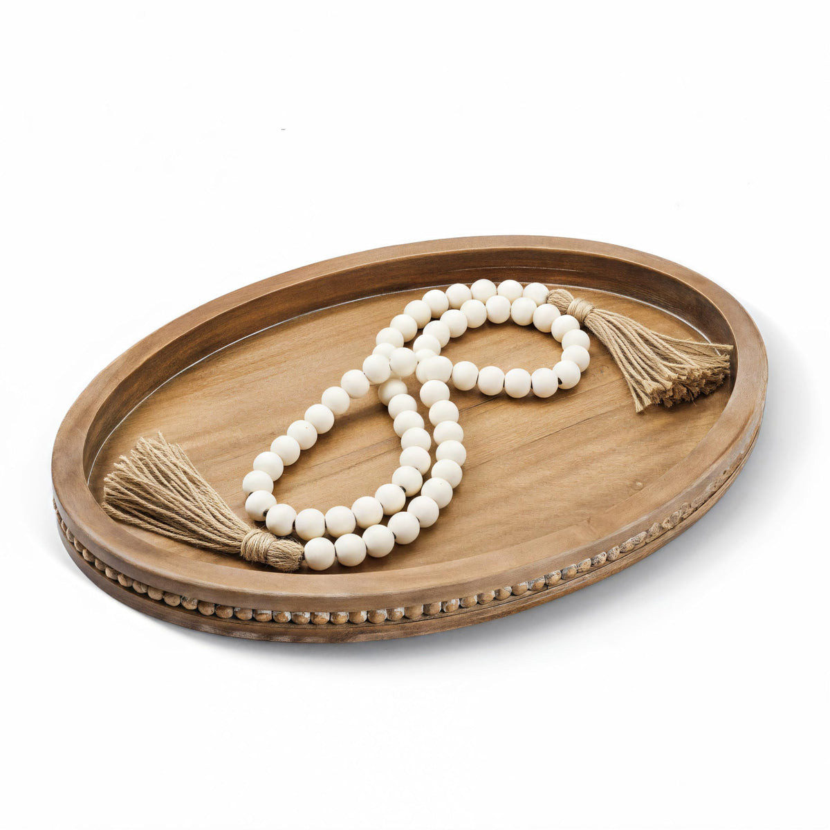 Relaxing Garden oval wood tray showcases a chic coffee table centerpiece and organized surface.