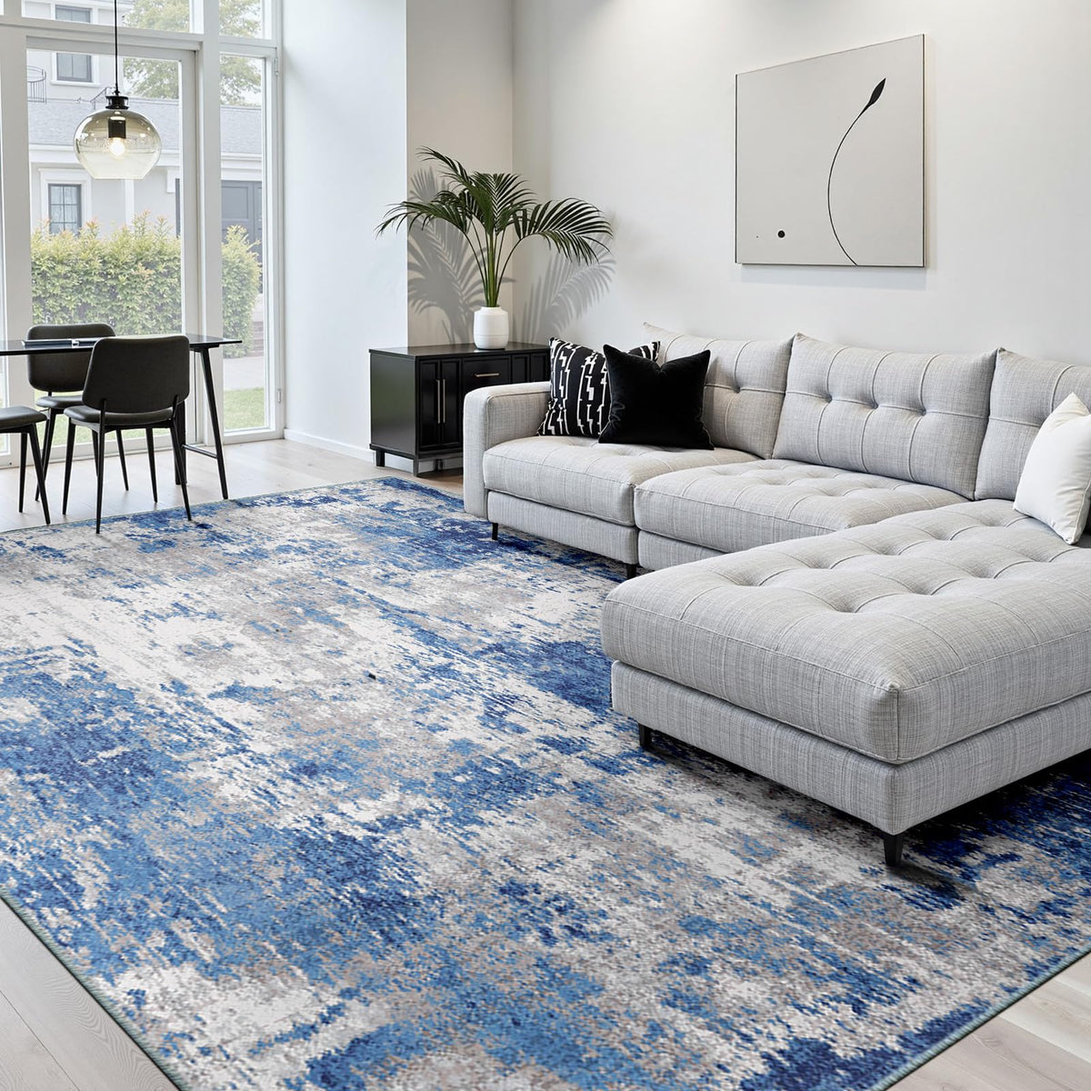 RELEANY washable area rug with blue gray abstract pattern and non-slip backing for secure placement.