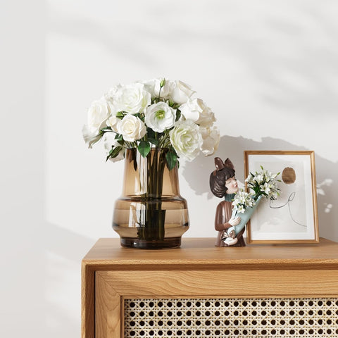 Relexome amber vase on office desk creates a calm focal point