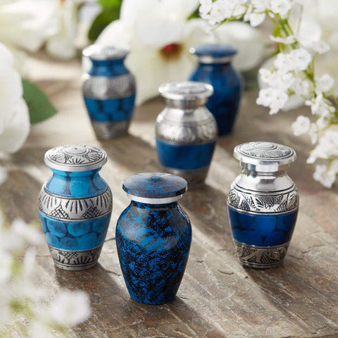 Reminded blue-silver mini urns offer a respectful keepsake option for loved ones