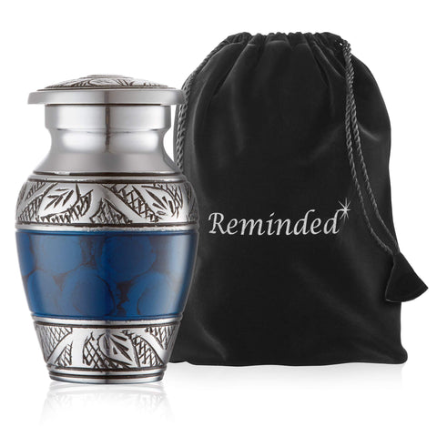 Reminded urns in satin-lined case with velvet bag for protection against dust