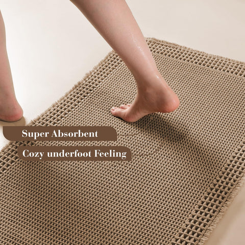 RESARE waffle bath mat in brown with tassels soaks up water and adds cozy texture.