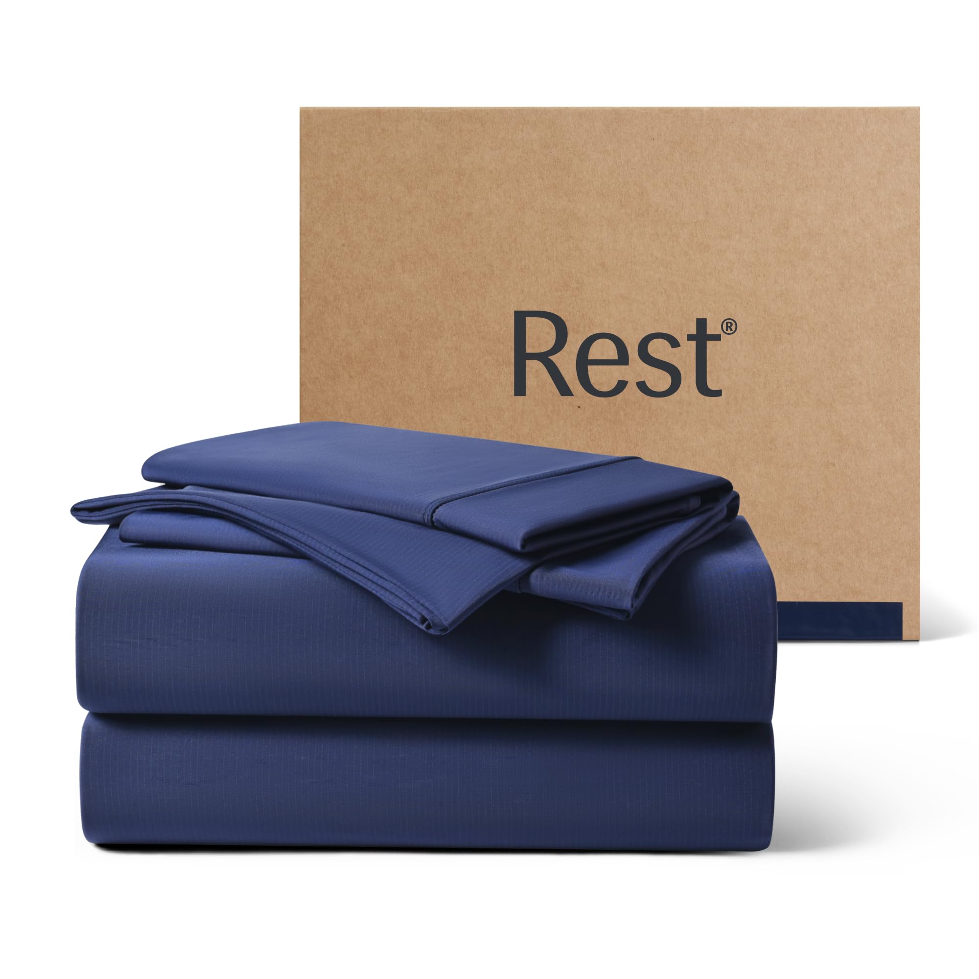 REST Evercool+ cooling sheets in midnight blue on a queen bed for hot sleepers.