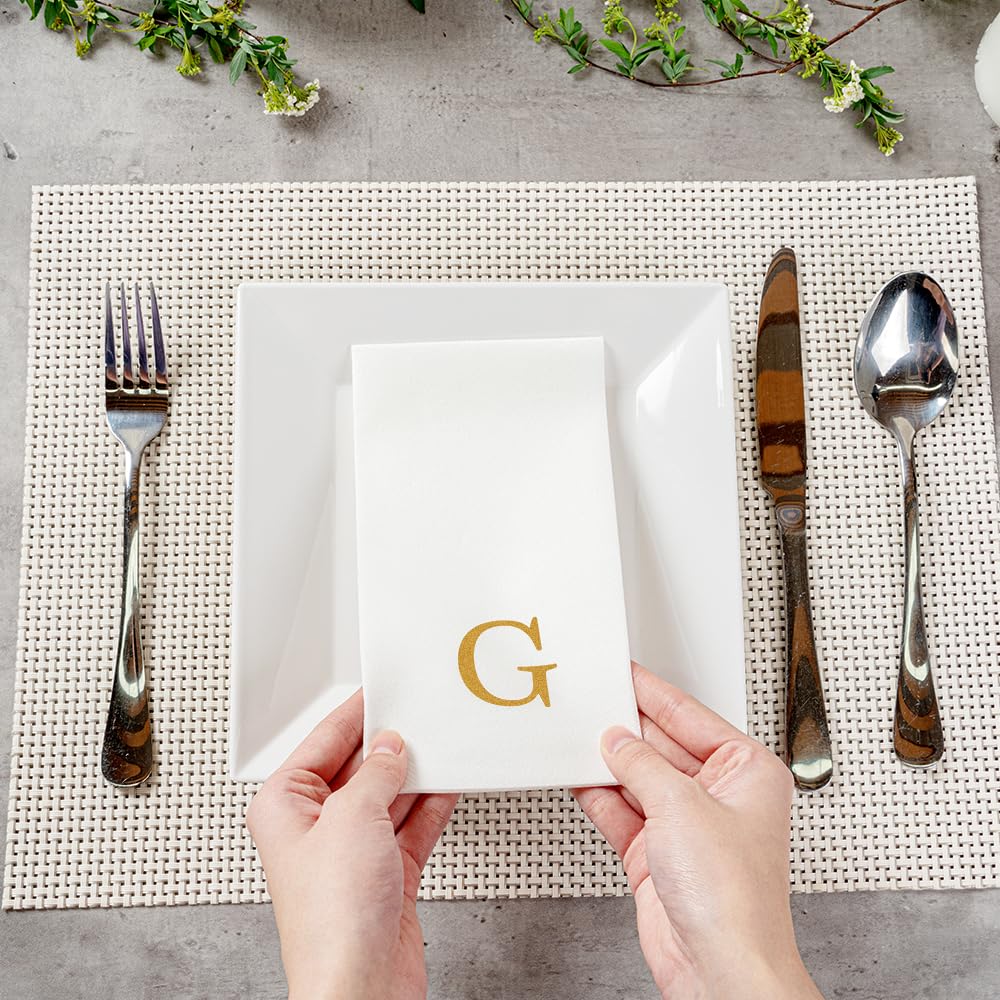 Gold monogram napkin adds sophisticated table accent for celebrations.