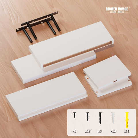 Richer House living room display white floating shelves for plants and books.