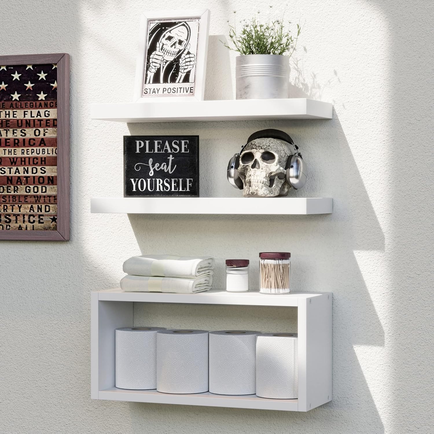 Richer House white floating shelves over the toilet provide tidy bathroom storage.