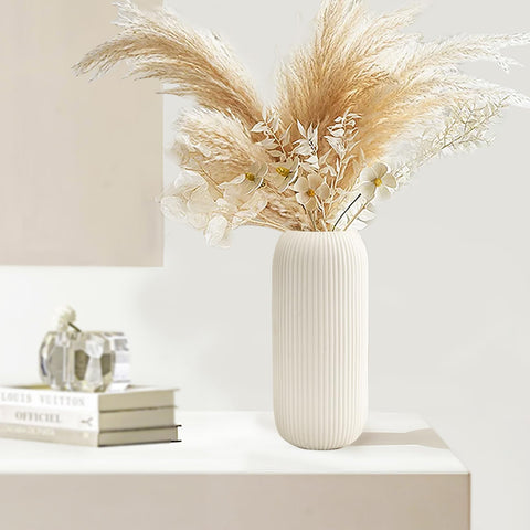RIKBVOM white ribbed vase showcasing pampas grass on a coffee table.