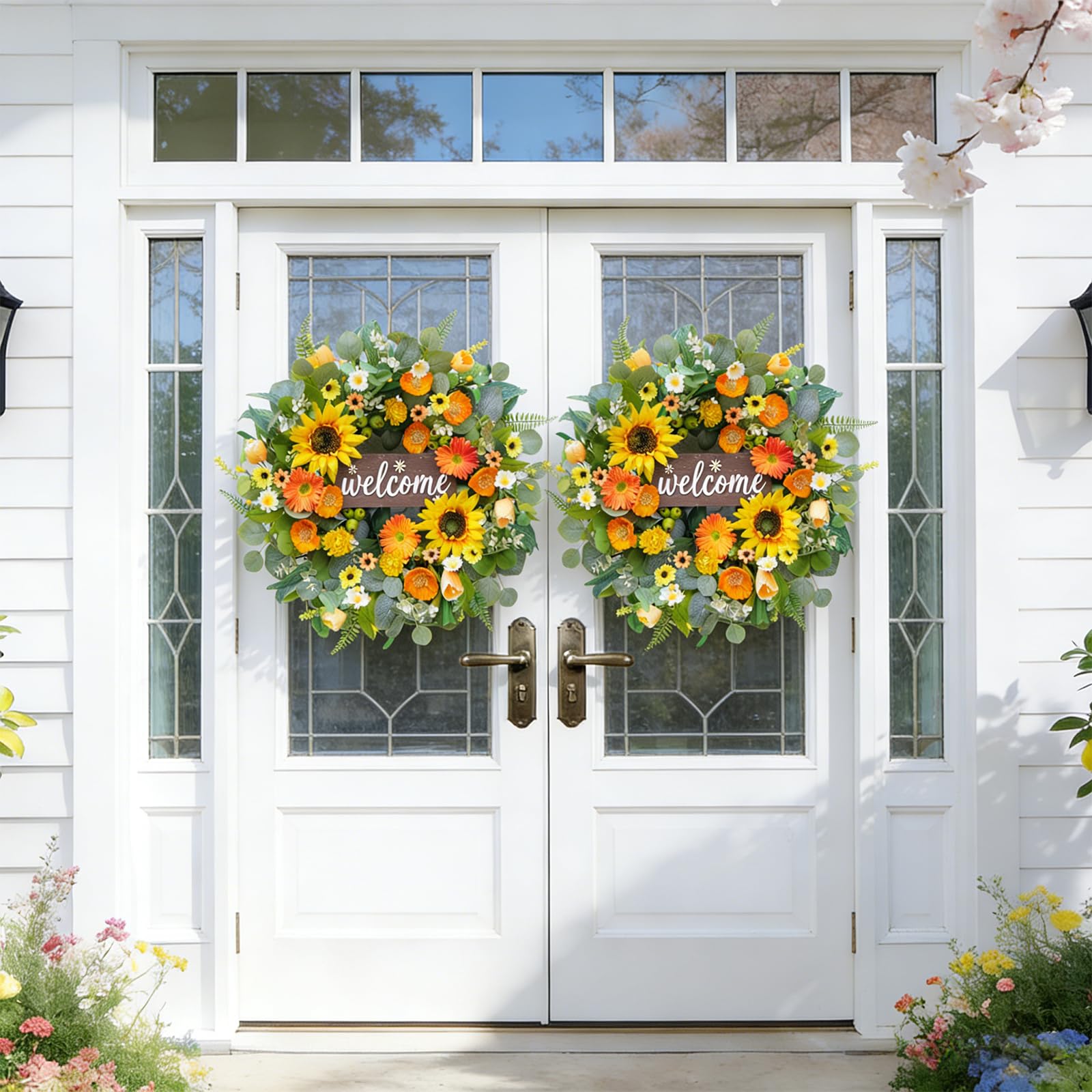 Rimalo orange gerberas and daisies wreath brightens entry with sunny vibes.