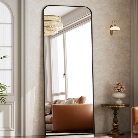Riskioir bedroom setup shows how the mirror brightens and enlarges space.