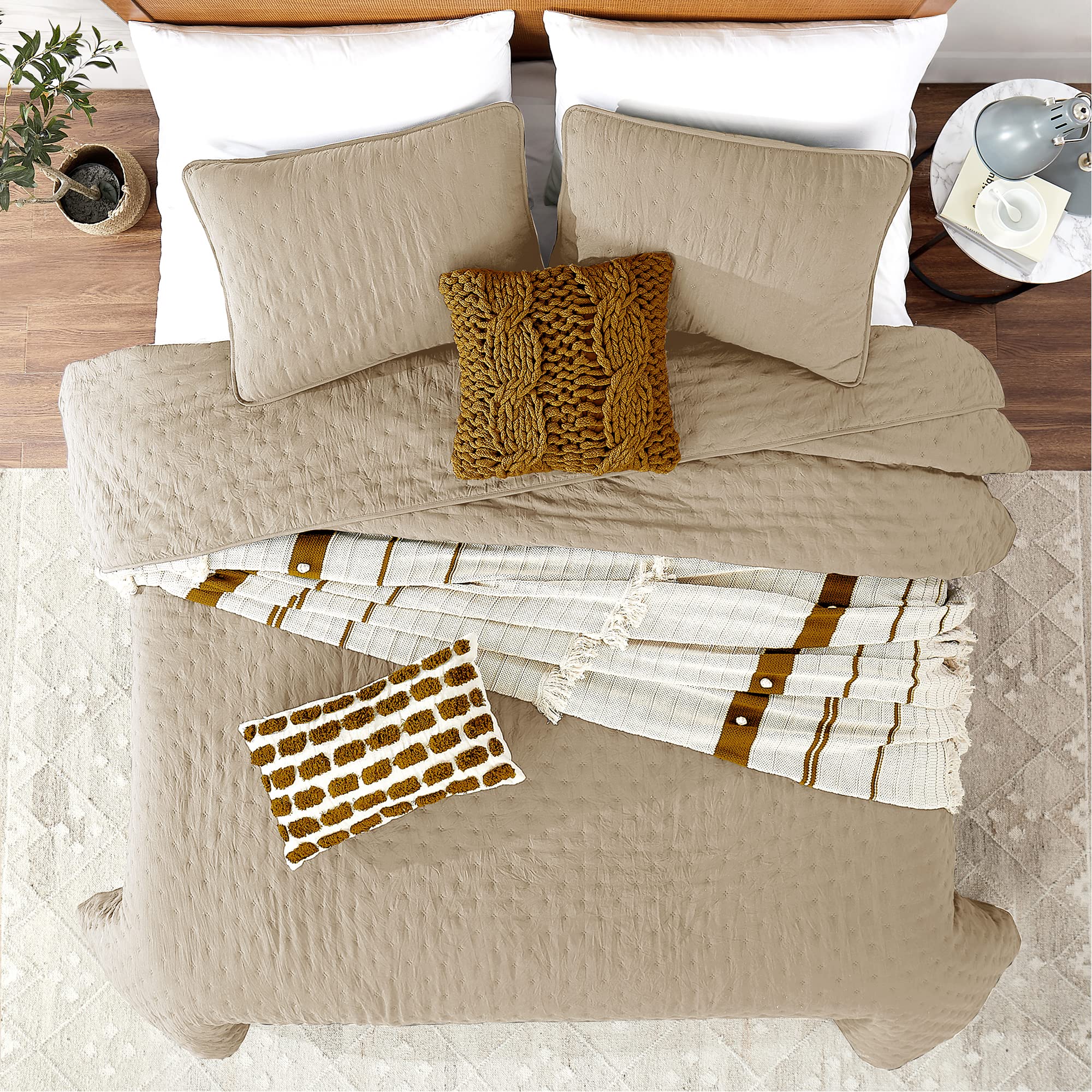 ROARINGWILD beige cloud pillow sham paired with quilt in rustic bedroom.