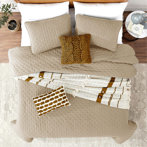ROARINGWILD beige cloud pillow sham paired with quilt in rustic bedroom.