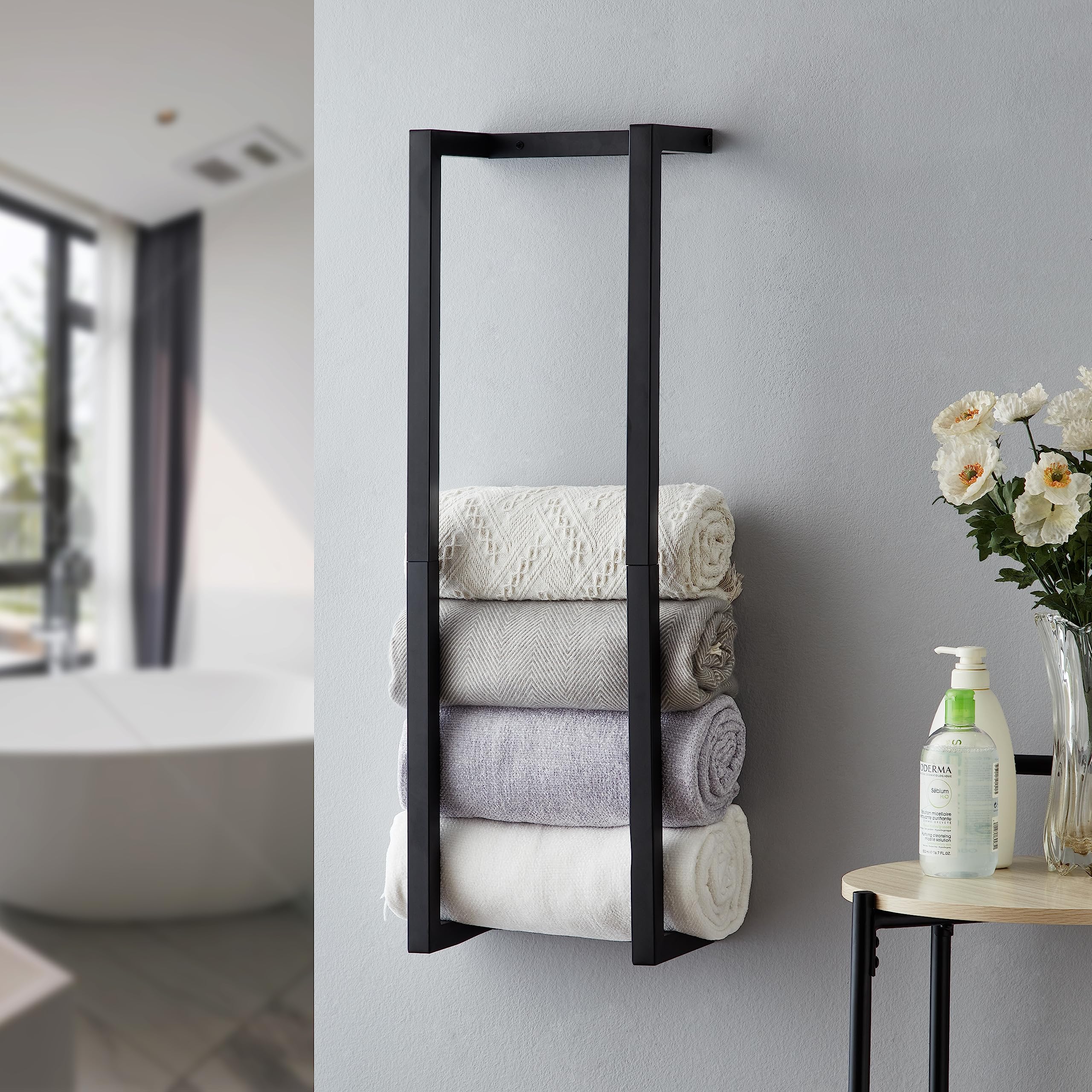 Roeveca towel rack for rolled towels, black wall mount saves space.